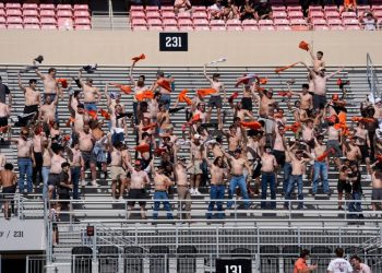 How a bet started a college football trend of shirtless fans