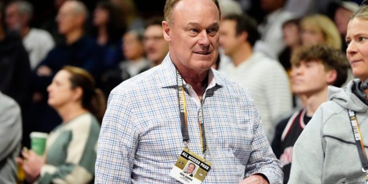 Colorado athletics director who hired Deion Sanders to step down next year