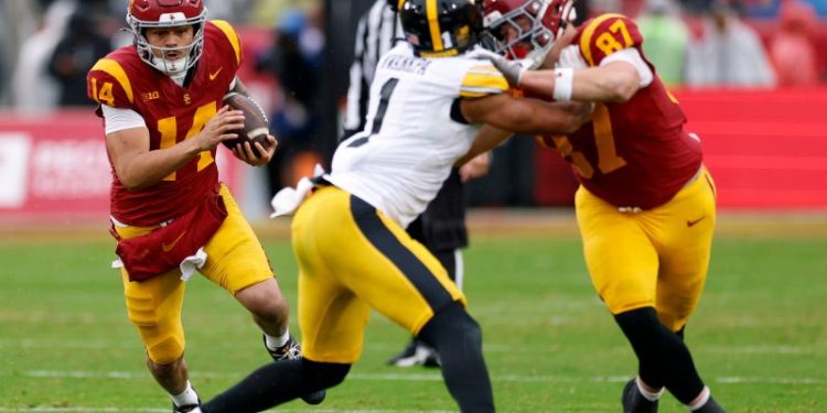 USC keeps CFP hopes alive with comeback win over Iowa