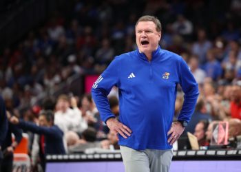 Kansas head coach Bill self hospitalized, did not travel with team
