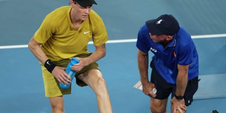 Cramping Jannik Sinner defeats American after roof is closed