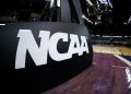 College basketball coach escorted off court in handcuffs: What we know