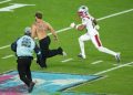 Super Bowl 60 briefly halted by fan on the field