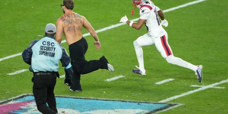 Super Bowl 60 briefly halted by fan on the field