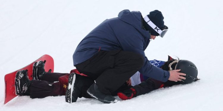 Snowboarder has major halfpipe crash, taken off by emergency sled
