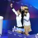 17-year-old Ami Nakai hugs Alysa Liu after both skaters medal at Olympics